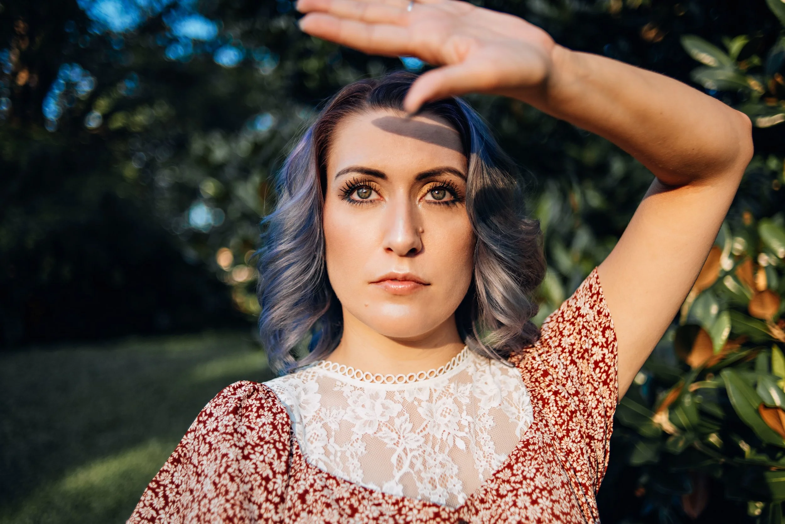 Cammie blocking sun, outdoor portrait